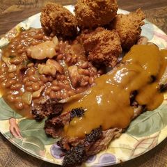 Brad's smoked brisket w/ Carolina BBQ & jalapeño cheese hushpuppies A picture of Brad's smoked brisket w/ Carolina BBQ & jalapeño cheese hushpuppies.