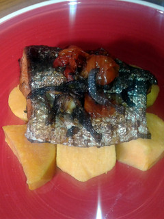 A picture of Oven baked salmon with sweet potatoes.