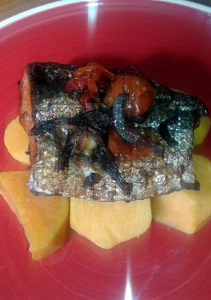 A picture of Oven baked salmon with sweet potatoes.