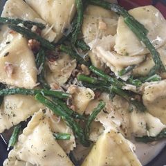 A picture of Ravioli With Sautéed Asparagus And Walnuts.