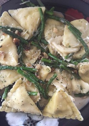 A picture of Ravioli With Sautéed Asparagus And Walnuts.