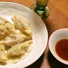 A picture of Boiled Gyoza Dumplings With Slippery Smooth Homemade Skins.