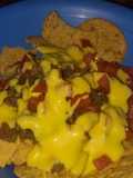 Nachos with Pork Rinds Covered in Yellow Cheese