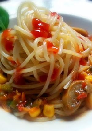 A picture of Spaghetti with vegetables sauce.
