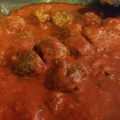 A picture of Italian Meat Balls in sauce.