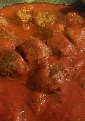 A picture of Italian Meat Balls in sauce.