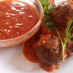 A picture of Meat balls in sauce.