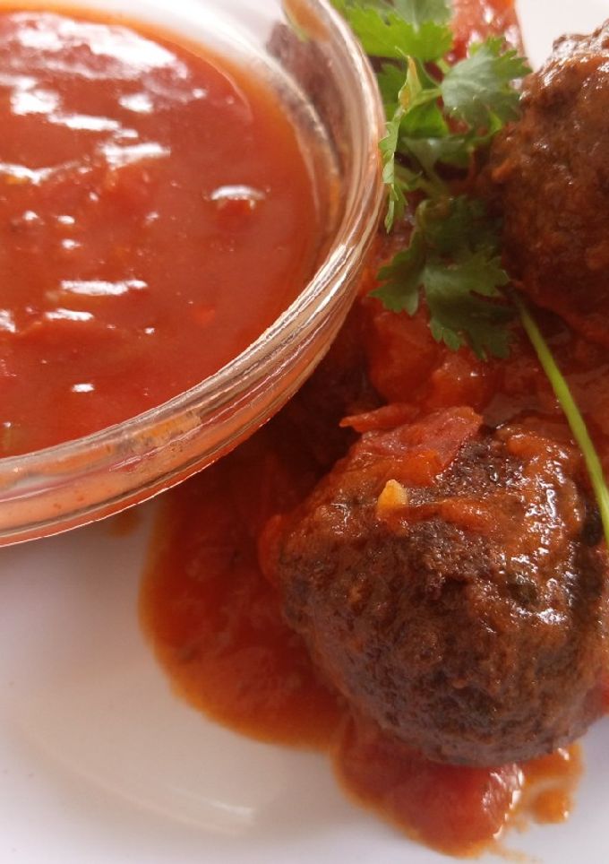A picture of Meat balls in sauce.