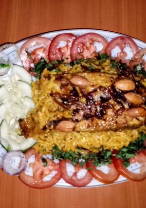 A picture of Fish kabsa 🐠🍅🌿.
