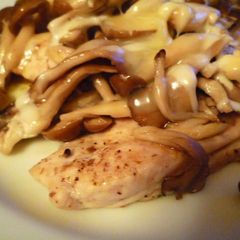 A picture of Steamed Mushrooms and Chicken Tenderloins with Cheese.