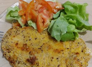 Una foto de Milanesas de suprema rebozado con avena y polenta