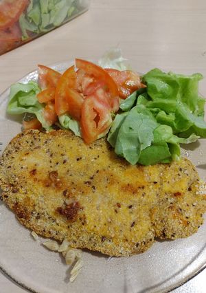 Una foto de Milanesas de suprema rebozado con avena y polenta