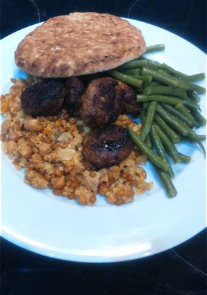 A picture of Lamb meatballs with green beans and warm Moroccan salad, for 2.
