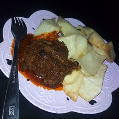 A picture of Fried yam with stew.