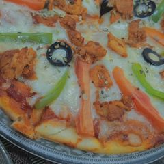 A picture of Chicken vegetable pizza.
