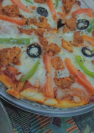 A picture of Chicken vegetable pizza.