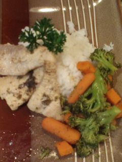 A picture of Catfish and rice.