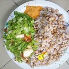 A picture of Shinkafa da wake (garau-garau) with local salad.