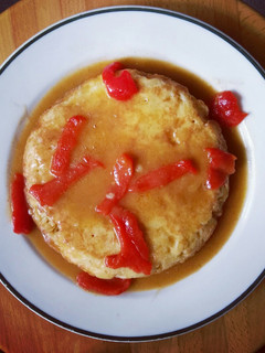 Una foto de Tortilla de patata guisada con pimientos