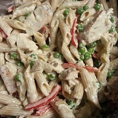 A picture of Chicken Penne Alfredo with veggies and homemade sauce.