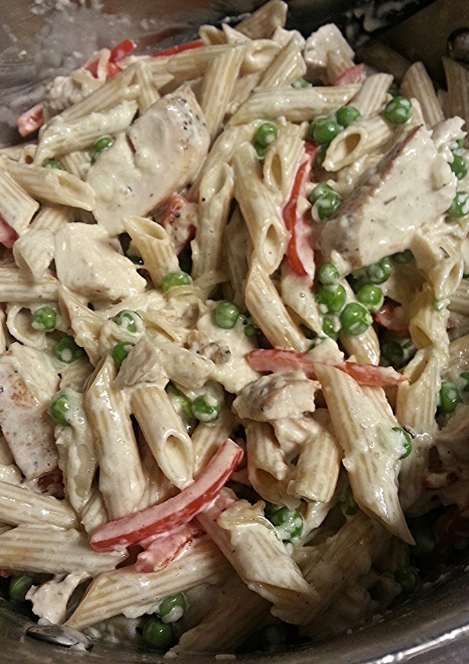 A picture of Chicken Penne Alfredo with veggies and homemade sauce.