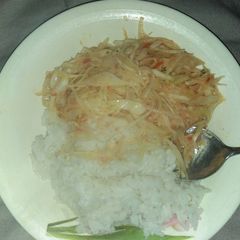 A picture of White rice and cabbage.