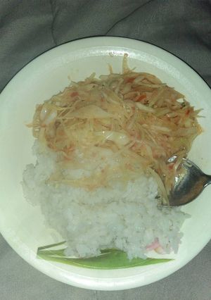A picture of White rice and cabbage.