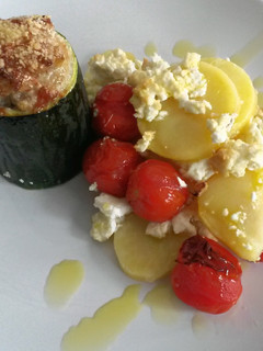 A picture of Zucchini filled with minced meat.