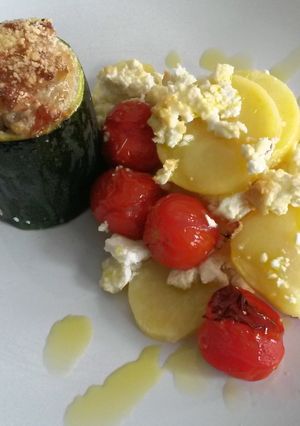 A picture of Zucchini filled with minced meat.