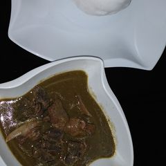 A picture of Tuwo and baobab soup.