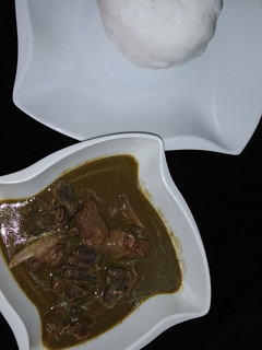 A picture of Tuwo and baobab soup.