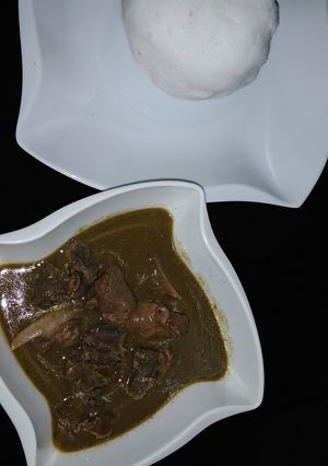 A picture of Tuwo and baobab soup.