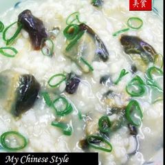 Hong Kong-Style Authentic Chinese Century Egg & Pork Rice Porridge A picture of Hong Kong-Style Authentic Chinese Century Egg & Pork Rice Porridge.