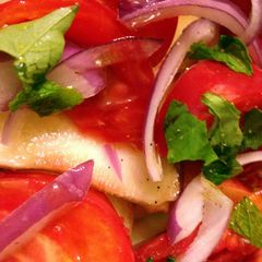 A picture of Peach and Heirloom Tomato Salad.
