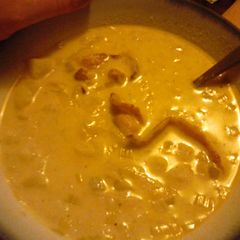 A picture of Leek and Potato soup with bacon.