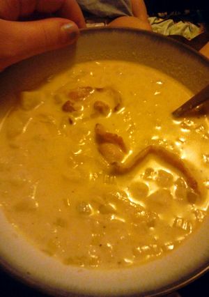 A picture of Leek and Potato soup with bacon.