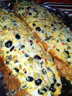 A picture of ¤Ree Drummond's Olive Cheese Bread¤.