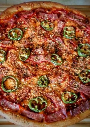 A picture of Homemade jalapeño and pepperoni bacon pizza.