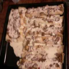 Una foto de Canelones de carne con salsa bechamel