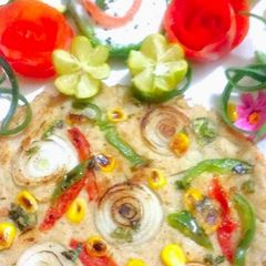 A picture of Oats Corn Uttapam.