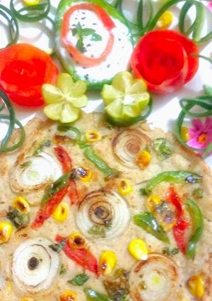 A picture of Oats Corn Uttapam.
