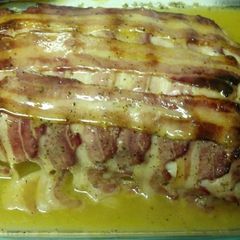 A picture of Bacon wrapped lemon pepper pork loin.