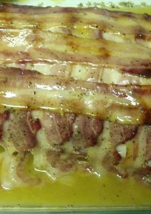 A picture of Bacon wrapped lemon pepper pork loin.