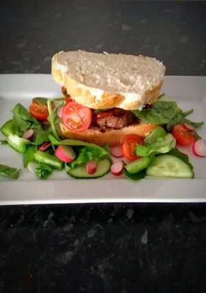 A picture of Cheese burger with a twist.