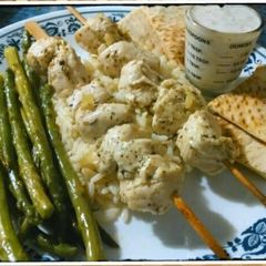 A picture of Chicken Souvlaki with Tzatziki sauce.
