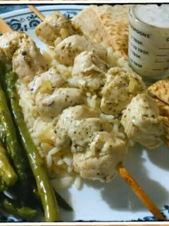 A picture of Chicken Souvlaki with Tzatziki sauce.