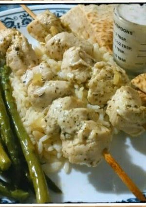 A picture of Chicken Souvlaki with Tzatziki sauce.