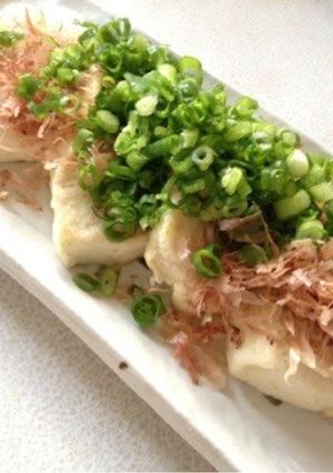 A picture of Looks like a Feast Firm Tofu with Bonito Flakes and Green Onion.