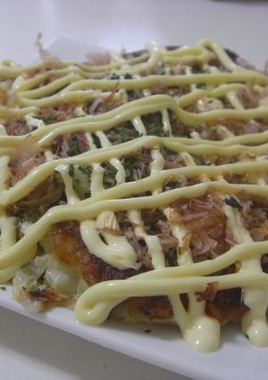 A picture of Okonomiyaki that's Crispy Outside and Fluffy Inside.