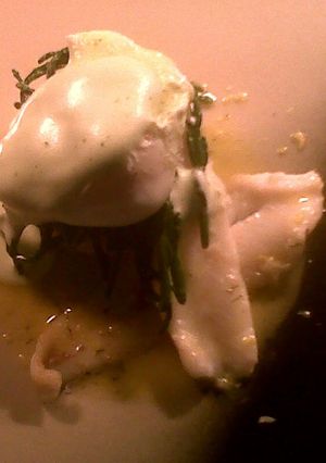 A picture of lemon sole with a tartare potato cake samphire and lemon butter sauce finished with parsley foam.